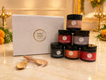 The Humble Gift Box with six Humble Origins jars and wooden spoons beside a white gift box, styled for Diwali