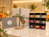 Complete Wellness Collection of nine Humble Origins jars beside a white gift box tied with twine and wooden spoons, styled for Diwali