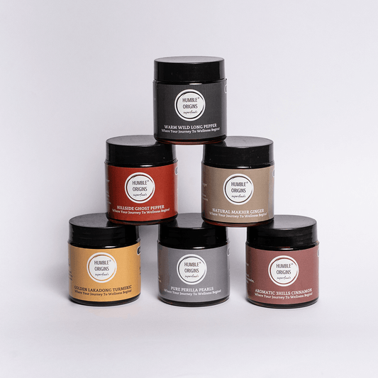 Collection of 'Humble Organics' product jars on a white background