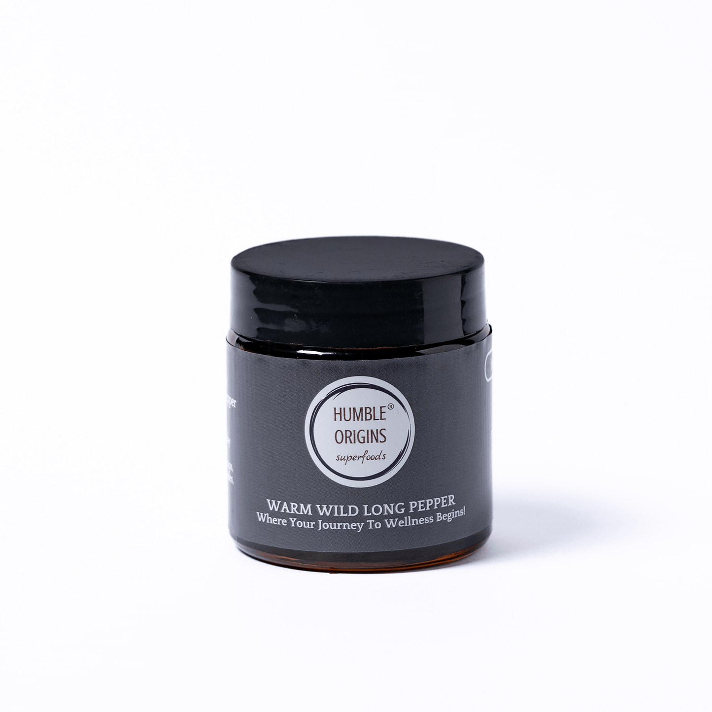 Black jar with a label on a white background