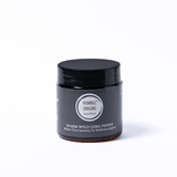 Black jar with a label on a white background