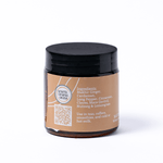 Jar with a black lid and brown label on a white background