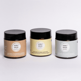 Three jars of 'Humble Origins' on a white background